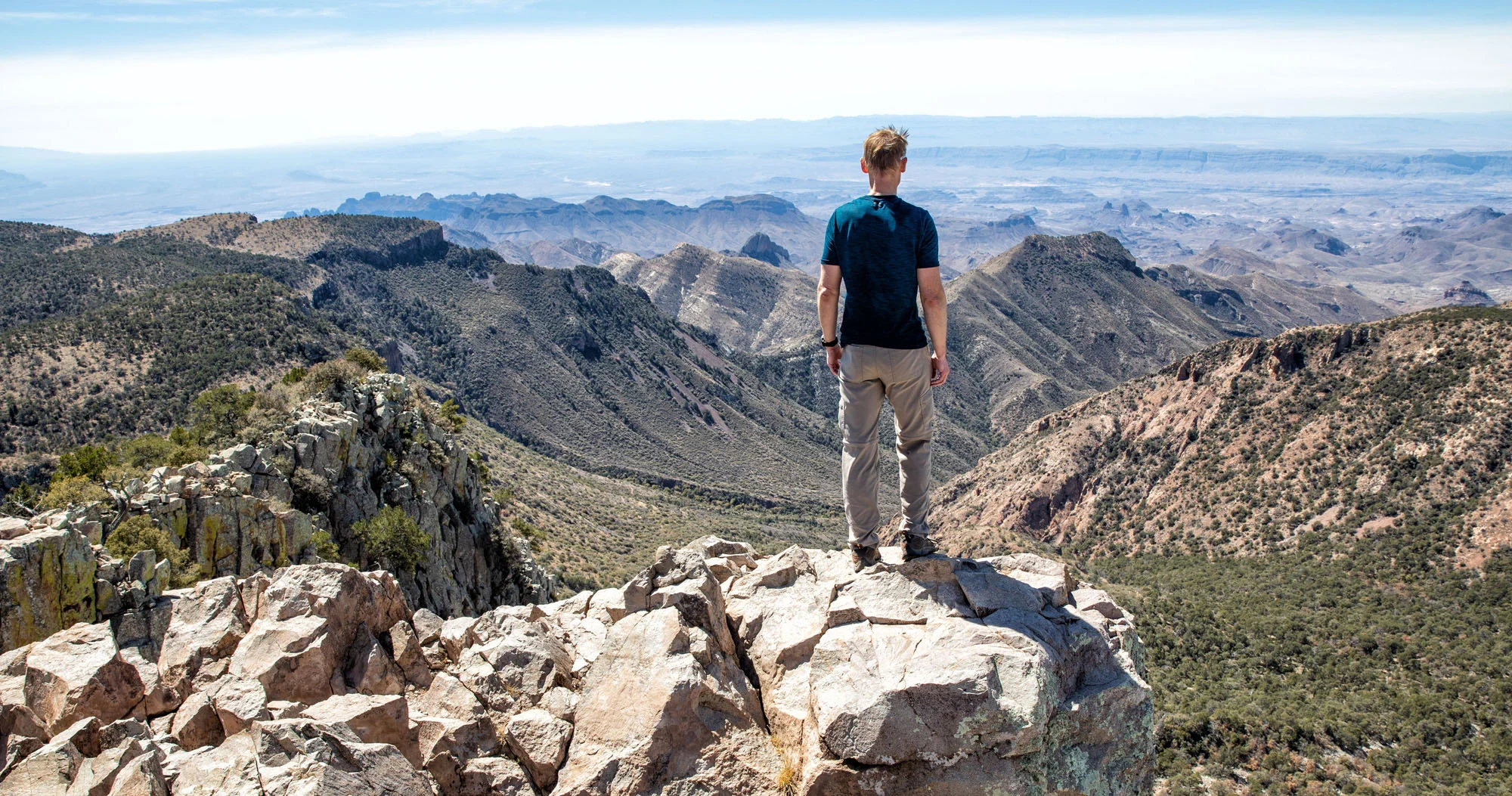 A high, sweeping view from Emory Peak in Big Bend National Park looking out over the Chisos Mountains and the desert far below