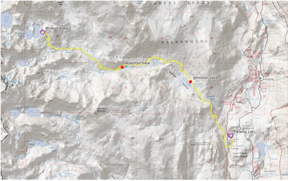 A real photo of a day hiker packing a small backpack at a trailhead with a paper map, water bottle, sunscreen, and snacks laid out on a picnic table