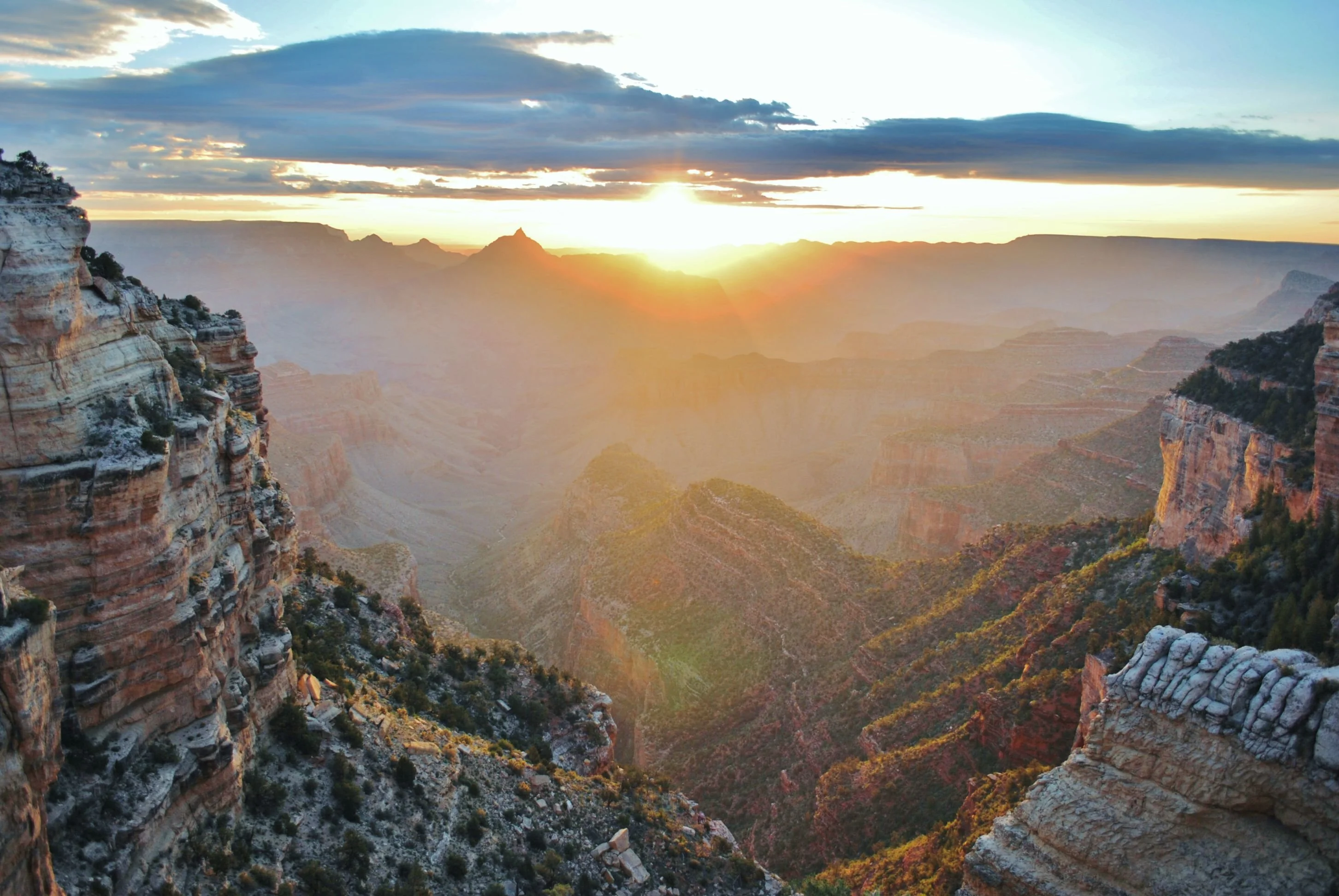 Desert View Watchtower on the South Rim in warm early light, with the canyon stretching into the distance