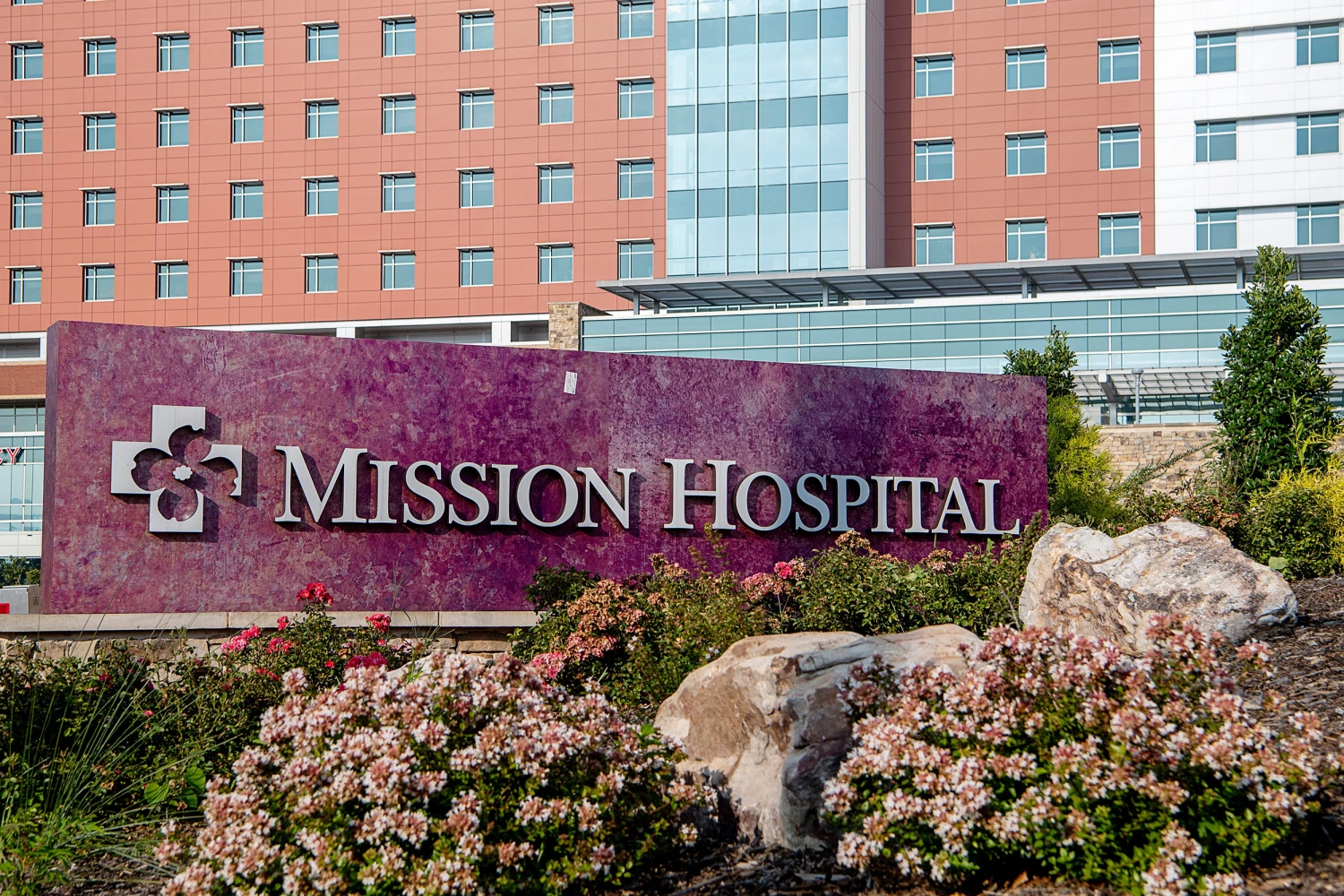 The entrance area of Mission Hospital in Asheville with visible signage and a vehicle drop-off lane